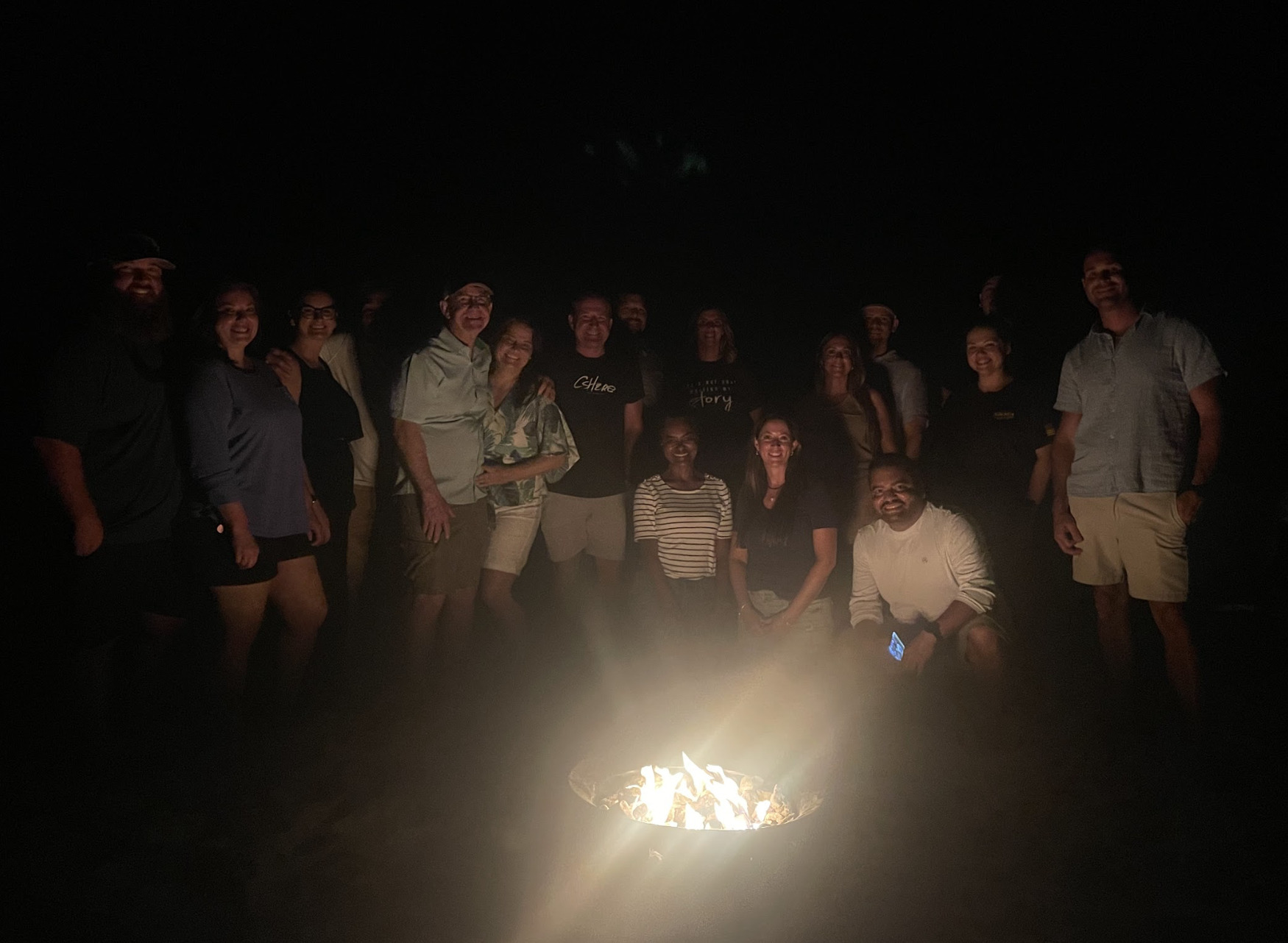 Group around bonfire at night